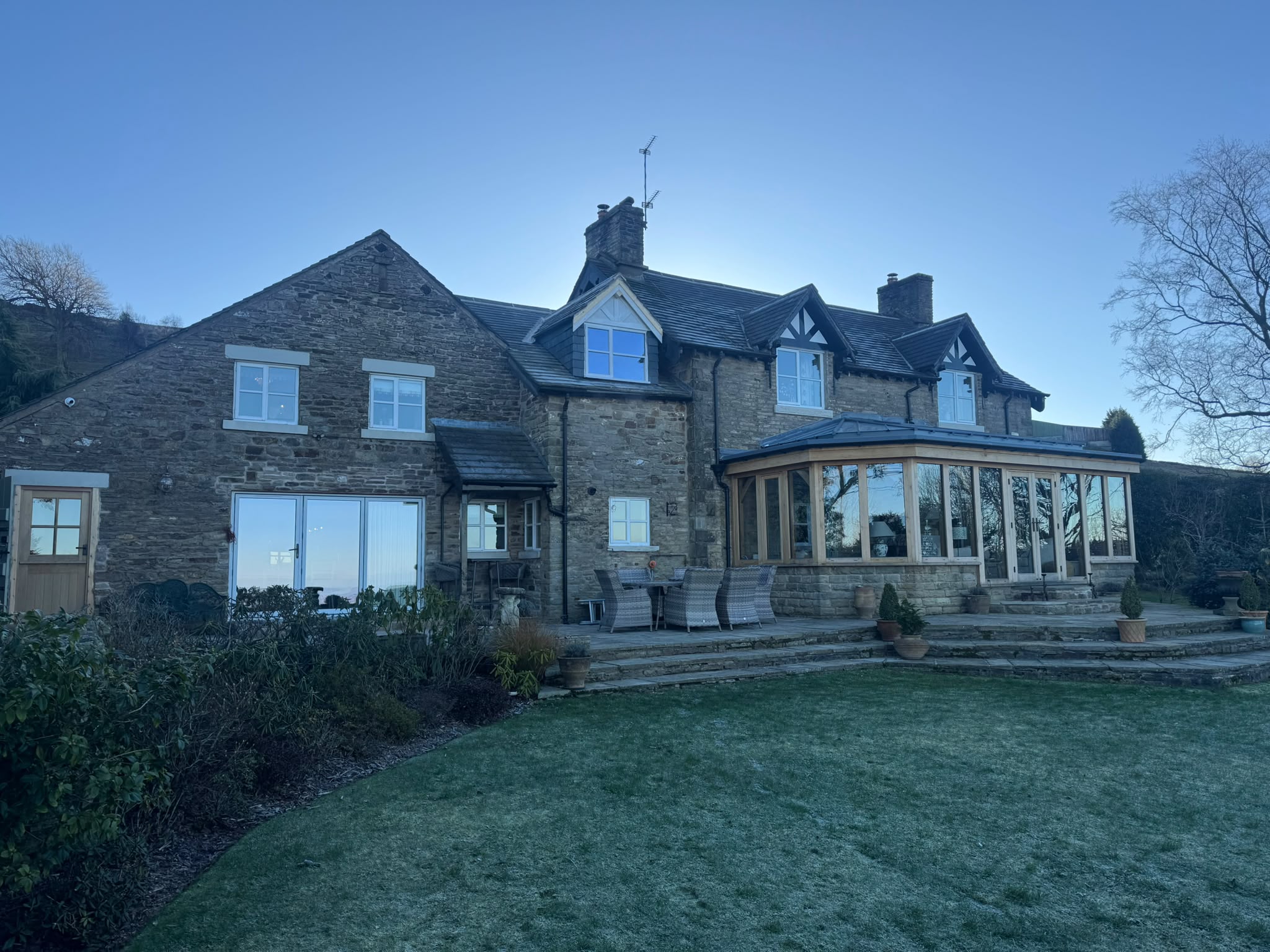 Completed rear elevation of a stone property renovated by Total Build